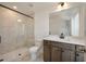 Modern bathroom with tiled shower, quartz countertop, and sleek fixtures at 410 Katies Scenic Ct, Charleston, SC 29492