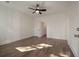 Bright bedroom with hardwood floors, ceiling fan, and white trim at 410 Katies Scenic Ct, Charleston, SC 29492