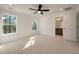 Bright bedroom featuring neutral carpet, an ensuite bathroom, and large windows at 410 Katies Scenic Ct, Charleston, SC 29492