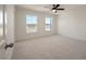 Bright, carpeted bedroom featuring two windows and neutral color palette at 410 Katies Scenic Ct, Charleston, SC 29492