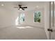 Bright, carpeted bedroom featuring two windows and neutral color palette at 410 Katies Scenic Ct, Charleston, SC 29492