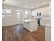 Modern white kitchen featuring a central island, stainless steel appliances, and pendant lighting at 410 Katies Scenic Ct, Charleston, SC 29492