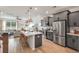 This luxury kitchen features stainless appliances, a large island and ample cabinets at 414 Duskywing Dr, Goose Creek, SC 29445
