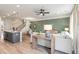 This stylish open concept features a kitchen island, modern light fixtures and spacious living area at 414 Duskywing Dr, Goose Creek, SC 29445