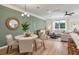 Open concept living room features a dining area, on-trend decor and a large bright sectional at 414 Duskywing Dr, Goose Creek, SC 29445