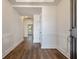 Inviting foyer features wood-look floors, a sleek door, and bright, white walls at 414 Katies Scenic Ct, Charleston, SC 29492