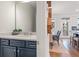 Charming half bathroom with a white countertop, navy blue cabinets, and wood plank flooring at 416 Katies Scenic Ct, Charleston, SC 29492