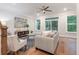 Comfortable living room featuring hardwood floors, a ceiling fan, plush seating, and access to the balcony at 416 Katies Scenic Ct, Charleston, SC 29492