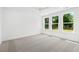 Bright bedroom with large windows providing natural light and neutral carpet flooring at 417 Grove End Rd, Moncks Corner, SC 29461