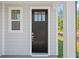 Elegant black front door with glass panes, framed by white trim, and a small window at 417 Grove End Rd, Moncks Corner, SC 29461