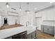 Modern kitchen with a large island, white countertop, and stainless-steel appliances in an open layout at 417 Grove End Rd, Moncks Corner, SC 29461