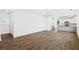 Spacious living room area with hardwood floors opens to a modern kitchen at 417 Grove End Rd, Moncks Corner, SC 29461