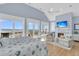 Bright bedroom with high ceilings, water views, fireplace, and hardwood floors at 45 Ocean Point Dr, Isle of Palms, SC 29451