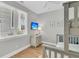 Bedroom with bunk bed, hardwood floors, and bright window with blinds at 45 Ocean Point Dr, Isle of Palms, SC 29451