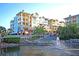 Beautiful condominiums overlooking a scenic pond with a fountain, offering tranquil waterfront views and luxurious living at 45 Ocean Point Dr, Isle of Palms, SC 29451