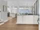 Inviting entryway with hardwood floors, custom millwork and designer details leading to the kitchen and living spaces at 45 Ocean Point Dr, Isle of Palms, SC 29451