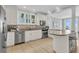 Modern kitchen with stainless steel appliances, granite countertops, and a breakfast bar with beautiful views at 45 Ocean Point Dr, Isle of Palms, SC 29451