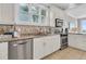 Well-appointed kitchen featuring stainless steel appliances, granite countertops, and tile flooring at 45 Ocean Point Dr, Isle of Palms, SC 29451