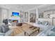 Spacious living room flowing into dining area and kitchen, with a fireplace and ocean views at 45 Ocean Point Dr, Isle of Palms, SC 29451