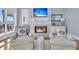 Bright living room with a fireplace, comfortable seating, and beachy accents at 45 Ocean Point Dr, Isle of Palms, SC 29451