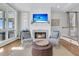 Comfortable living room with fireplace, and views of the ocean and deck at 45 Ocean Point Dr, Isle of Palms, SC 29451