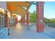 Inviting outdoor patio with tables and chairs in a landscaped, covered area for relaxing and socializing at 45 Ocean Point Dr, Isle of Palms, SC 29451