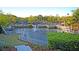 Scenic pond featuring a central fountain, lush greenery, and surrounding walking path creating a peaceful setting at 45 Ocean Point Dr, Isle of Palms, SC 29451
