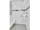 Walk-in shower with glass door, a tile accent wall, and chrome shower head at 45 Ocean Point Dr, Isle of Palms, SC 29451