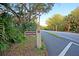 Community entrance with a Seagrass Lane sign amidst lush greenery, creating a welcoming ambiance at 45 Ocean Point Dr, Isle of Palms, SC 29451