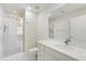 A well-lit bathroom features a glass-enclosed shower and a vanity with stone countertops at 498 Albemarle Rd # 306, Charleston, SC 29407