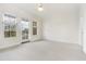 Bright bedroom with windows, ceiling fan, and access to balcony at 498 Albemarle Rd # 306, Charleston, SC 29407