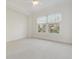 Light-filled bedroom with a window and neutral carpet at 498 Albemarle Rd # 306, Charleston, SC 29407