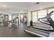The community fitness center features modern equipment and large windows for a bright workout space at 498 Albemarle Rd # 306, Charleston, SC 29407