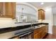 Kitchen with granite countertops, stainless steel appliances, wooden cabinets, and a stainless steel sink at 498 Albemarle Rd # 306, Charleston, SC 29407