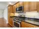 Well-lit kitchen features granite counters and stainless steel appliances at 498 Albemarle Rd # 306, Charleston, SC 29407