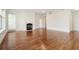 Spacious living room featuring hardwood floors, neutral paint, a fireplace, and a balcony at 498 Albemarle Rd # 306, Charleston, SC 29407