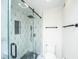 Stylish shower with decorative tile, glass door, and modern fixtures at 5541 Green Dolphin Way, Kiawah Island, SC 29455