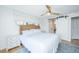 This charming bedroom features a stylish sliding barn door and serene decor at 5541 Green Dolphin Way, Kiawah Island, SC 29455