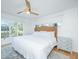 Bright bedroom featuring a large window with views of the surrounding landscape at 5541 Green Dolphin Way, Kiawah Island, SC 29455