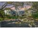 Picturesque community buildings with awnings nestled among lush trees and foliage at dusk at 5541 Green Dolphin Way, Kiawah Island, SC 29455