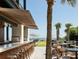 Charming outdoor bar and seating area with ocean views at 5541 Green Dolphin Way, Kiawah Island, SC 29455