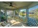 Relaxing screened porch with ceiling fan and views of the tranquil lake and surrounding scenery at 5541 Green Dolphin Way, Kiawah Island, SC 29455