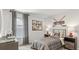 Bright bedroom featuring window, sports themed decor, and comfortable furnishings at 7002 Deanston Dr, Ravenel, SC 29470