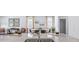 Dining area featuring modern decor, hardwood floors, and an open view into the kitchen at 7002 Deanston Dr, Ravenel, SC 29470