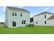 A cozy backyard showcases a well-kept green lawn, providing an inviting outdoor space for relaxation and enjoyment at 7014 Deanston Dr, Ravenel, SC 29470
