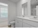 Bathroom with double vanity sinks, mirror, and shower with glass door at 7014 Deanston Dr, Ravenel, SC 29470