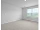 This bedroom features neutral walls, carpet, and plenty of natural light at 7014 Deanston Dr, Ravenel, SC 29470