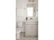 Well-lit bathroom with a modern vanity, stylish mirror, and patterned tile flooring, blending functionality with clean design at 711 Alma Square Dr, Moncks Corner, SC 29461
