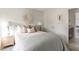 Serene bedroom with a beautifully styled bed, adorned with decorative pillows and a unique wall decoration at 711 Alma Square Dr, Moncks Corner, SC 29461