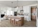 Modern kitchen featuring a central island, white cabinetry, pendant lights, and an open floor plan at 711 Alma Square Dr, Moncks Corner, SC 29461